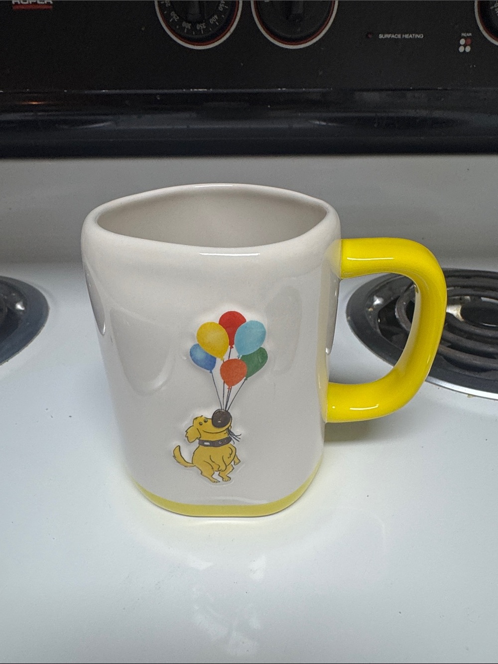 Rae Dunn White Ceramic Mug with Yellow Handle and Balloon Dog Art